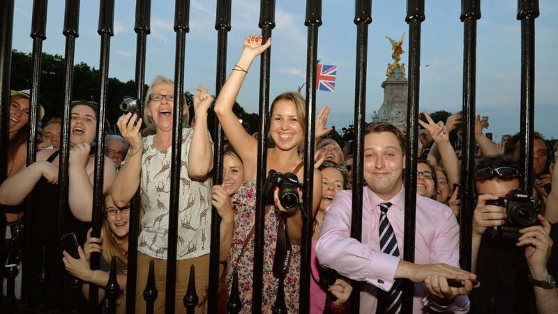 Crowds of people try to look at a notice formally announcing the birth of a son to Britain’s Prince William and Catherine, Duchess of Cambridge. Photograph: John Stillwell/Pool/Reuters