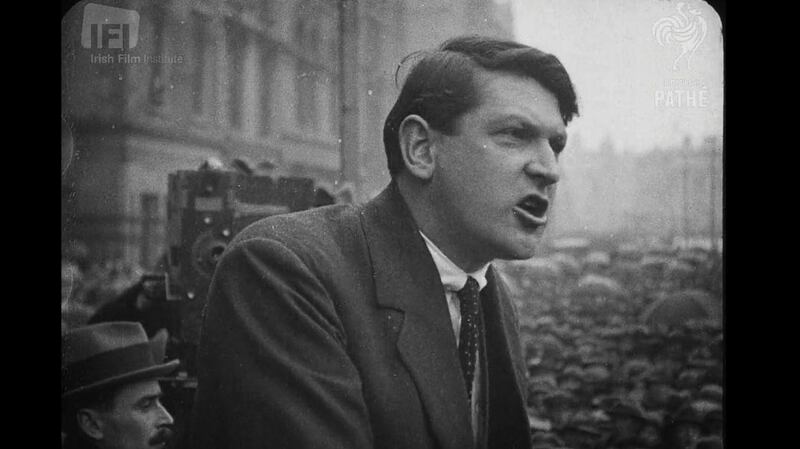 Michael Collins orates in front of a major crowd.