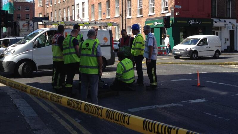 Workers investigating the cause of the explosion on Baggot Street. Photograph: Erin McGuire