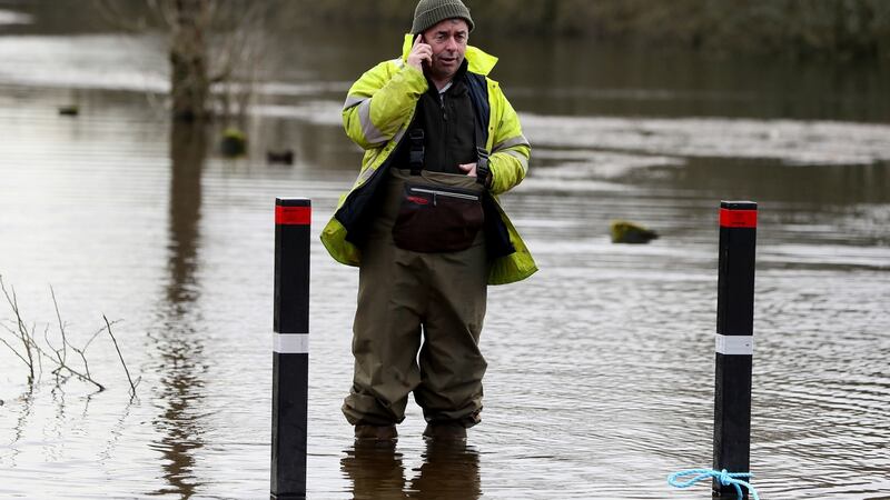 Minister of State with Responsibility for Flooding Kevin ‘Boxer’ Moran stands in flood water in Athlone, Co Westmeath on Sunday. Photograph: Brian Lawless/PA Wire