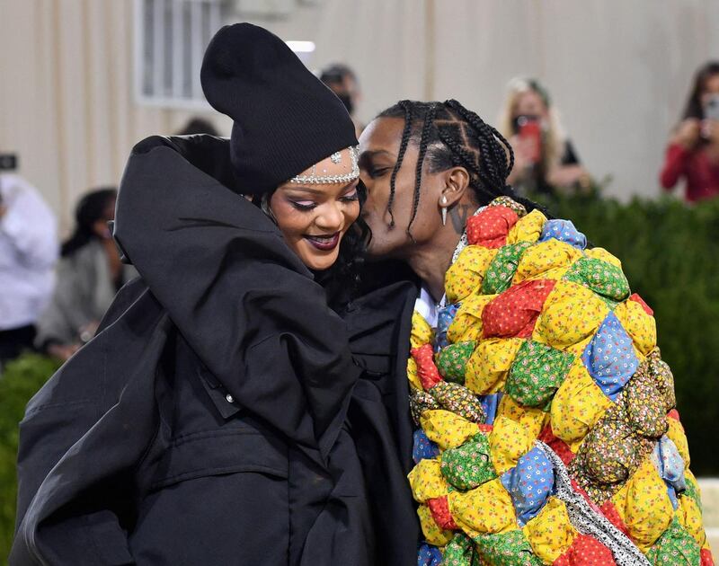 Rihanna, swathed in a Balenciaga couture coat, with an embellished head piece and black beanie. Her boyfriend ASAP Rocky wore a quilt by emerging Venice Beach designer Eli Russell Linnetz
