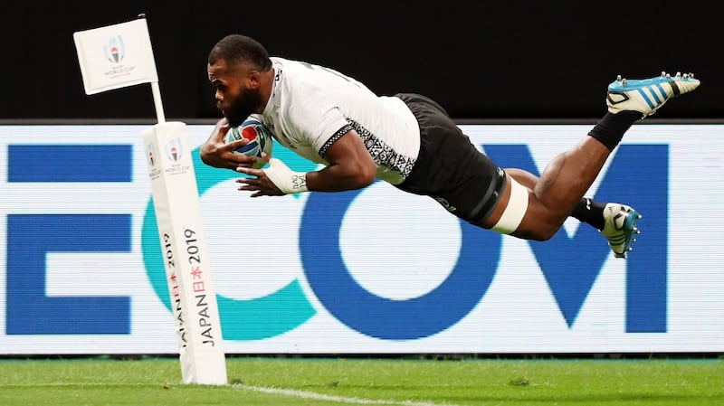 Peceli Yato dives to score Fiji’s first try in Sapporo. Photograph: Shaun Botterill/Getty