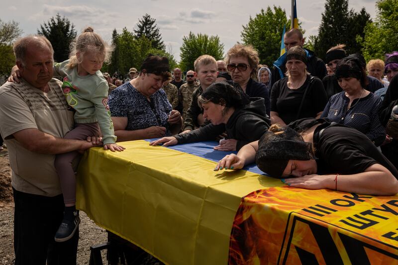 Family members mourn during the funeral last week of Oleksandr Shargorodskyi, a Ukrainian soldier who was killed in Bakhmut, Photograph: Nicole Tung/The New York Times