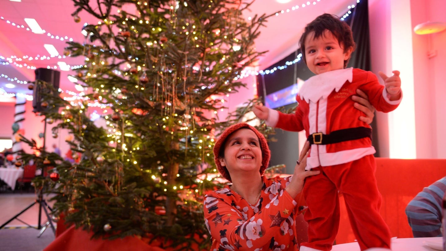 Shazia Butt and her son Muhammad Gabrielle (2) at the Knights of Columbanus Christmas dinnner in the RDS. Photograph: Dara Mac Dónaill