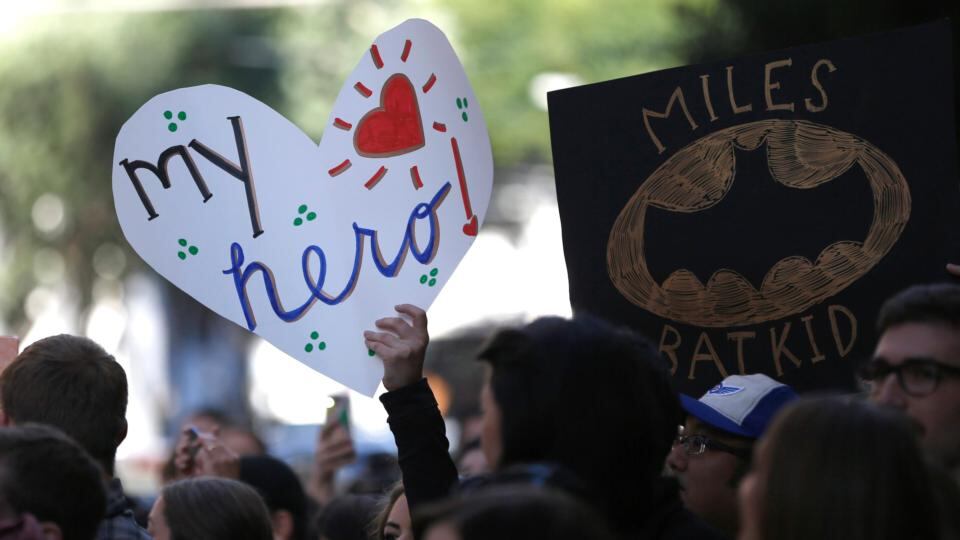 Fans of the five-year-old crime fighting hero Bat Kid line the streets of San Francisco. Photograph: Stephen Lam/Reuters