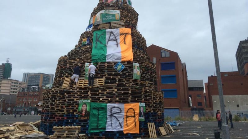The bonfire pyre at Sandy Row covered in Irish tri colours and nationalist political posters. Photograph: Dan Griffin/The Irish Times