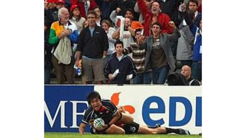 Japan's Koji Taira celebrates after scoring a try at the death
against Canada in Bordeaux