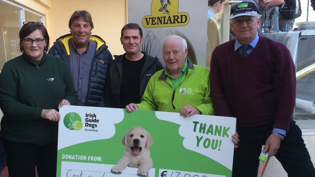 Frank Downes, branch chairman of Irish Guide Dogs (second from right) acknowledging contribution of €17,000 from Cast a Line for Autism competition from Dorrie Gibbons (left). Also included are: Basil Shields, Stevie Munn and John Gannon with guide dog Gallagher.
