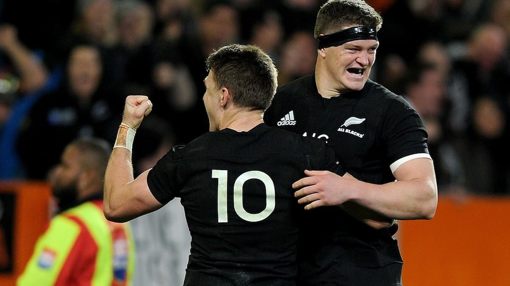 New Zealand’s Beauden Barrett celebrates his late try with his brother Scott. Photograph: Joe Allison/Inpho