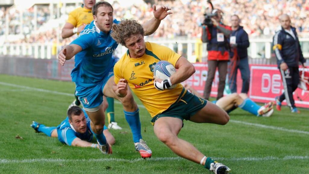 Nick Cummins of Australia breaks through to score his team’s second try against Italy at the Stadio Olimpico. Photograph: Harry Engels/Getty Images