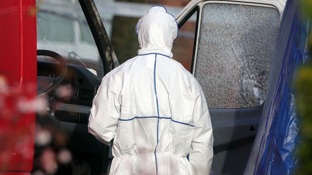 Gardaí examine a van with bullet holes in the windscreen and side window pictured this morning at the scene of the fatal shooting of a man in Glen Easton Park, Leixlip, Co. Kildare last night..Picture Colin Keegan, Collins Dublin.
