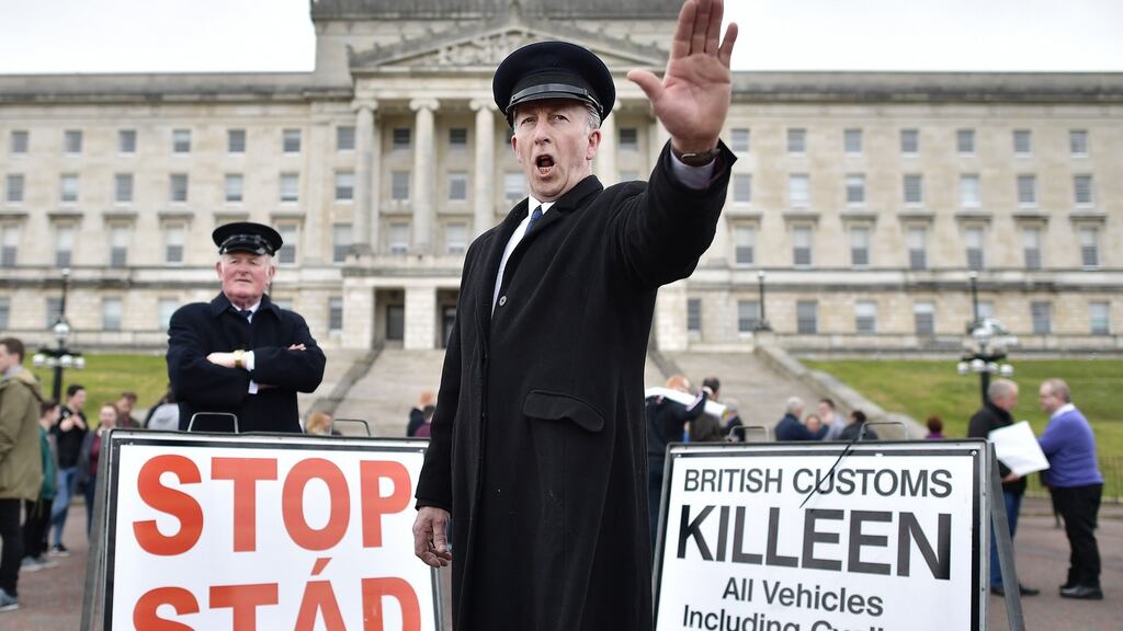 Men dressed as customs officers take part in a protest outside Stormont against Brexit and its possible effect on the Irish border. Photograph: Charles McQuillan/Getty Images