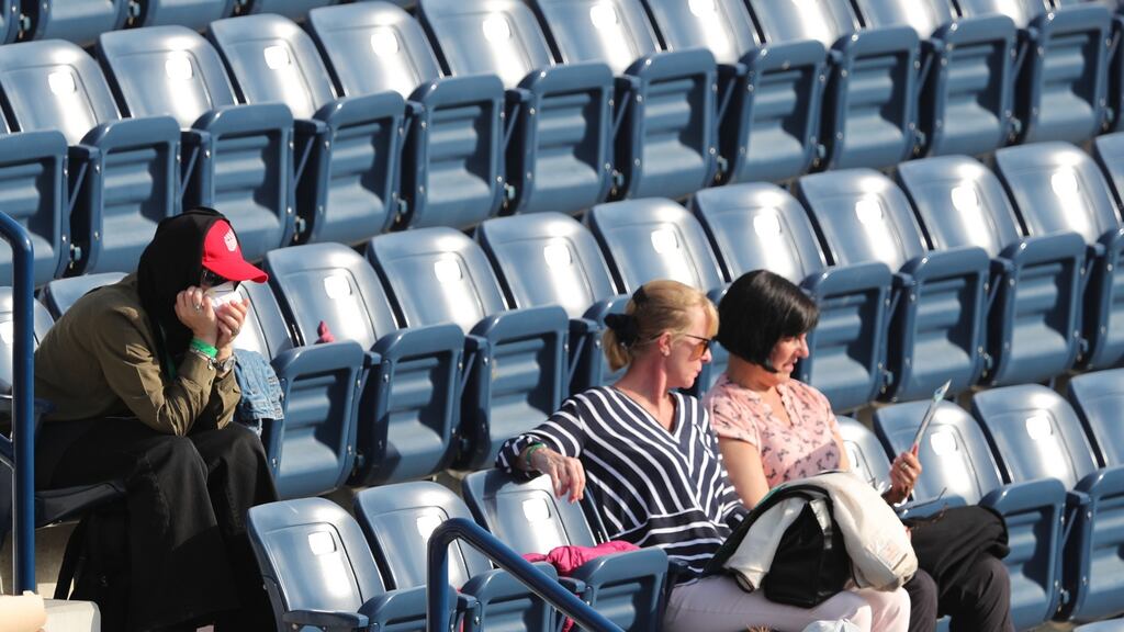 A spectator wears a face mask at the Dubai Duty Free Tennis ATP Championships in Dubai. Photograph: Ali Haider/EPA