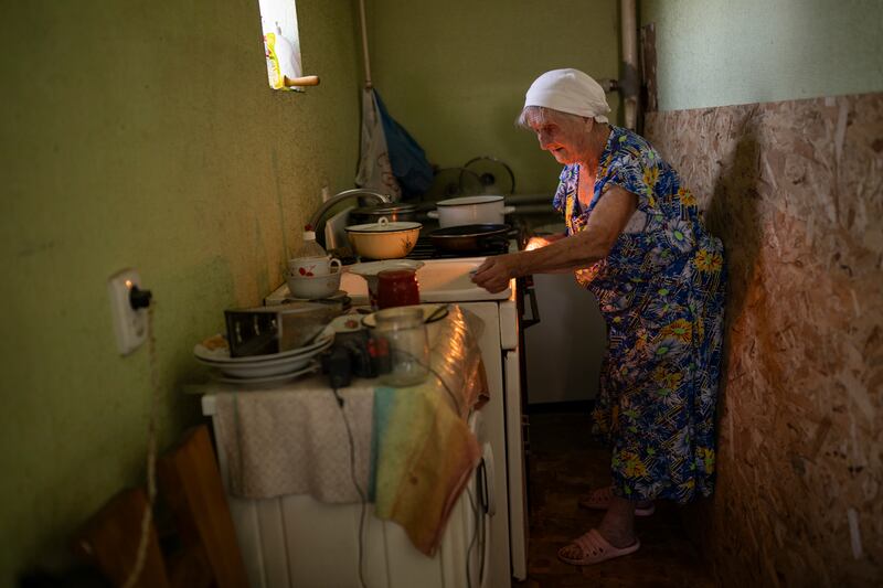 Lydia Pirozhkova (90), in the kitchen of a temporary home provided to her by a church after she evacuated from her home in Bakhmut, in Druzhkivka, Ukraine, on September 6th, 2023. Photograph: Lynsey Addario/New York Times)