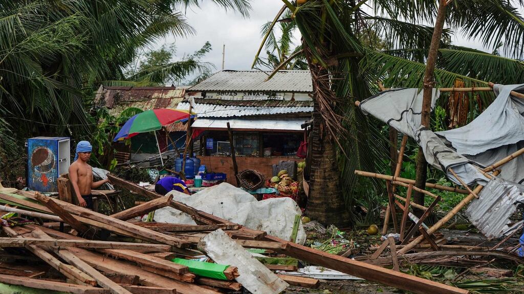 Christmas turned to chaos for many holiday observers in the central Philippines as a typhoon with strong winds and heavy rains destroyed homes, cut off power and stranded travellers, disaster officials said on Wednesday. Photograph: Bobbie Alota / AFP/ Getty Images