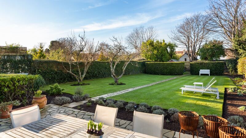 Mature garden with dining area.