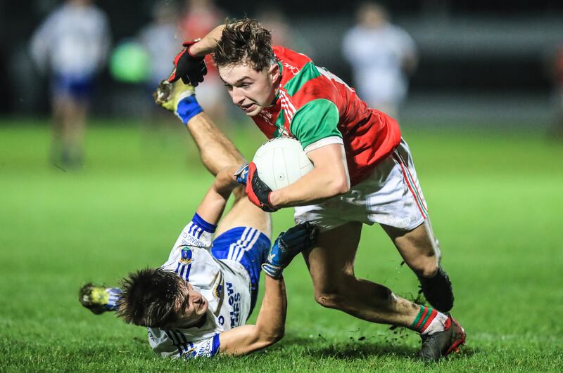 Palatine’s Conor Crowley with Simon Bouchier of St. Patrick’s. Photograph: Evan Treacy/Inpho