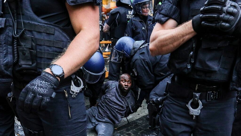 German police officers detain a man following a Black Lives Matter vigil at Alexanderplatz square in Berlin on June 6th. Photograph: Omer Messinger/EPA