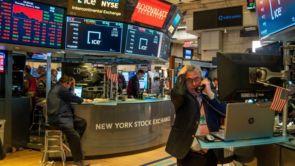 NEW YORK, NY - MARCH 05: Traders work the floor of the New York Stock Exchange (NYSE) on March 5, 2020 in New York City. After coronavirus infections rose steadily in the U.S. the DOW ends down over 950 points, nearly 3.6%. (Photo by David Dee Delgado/Getty Images)