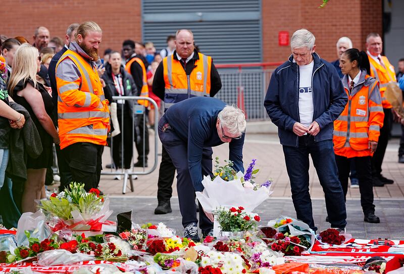 Everton manager David Moyes and assistant Alan Irvine lay a tribute at Anfield Stadium. Photograph: Peter Byrne/PA Wire