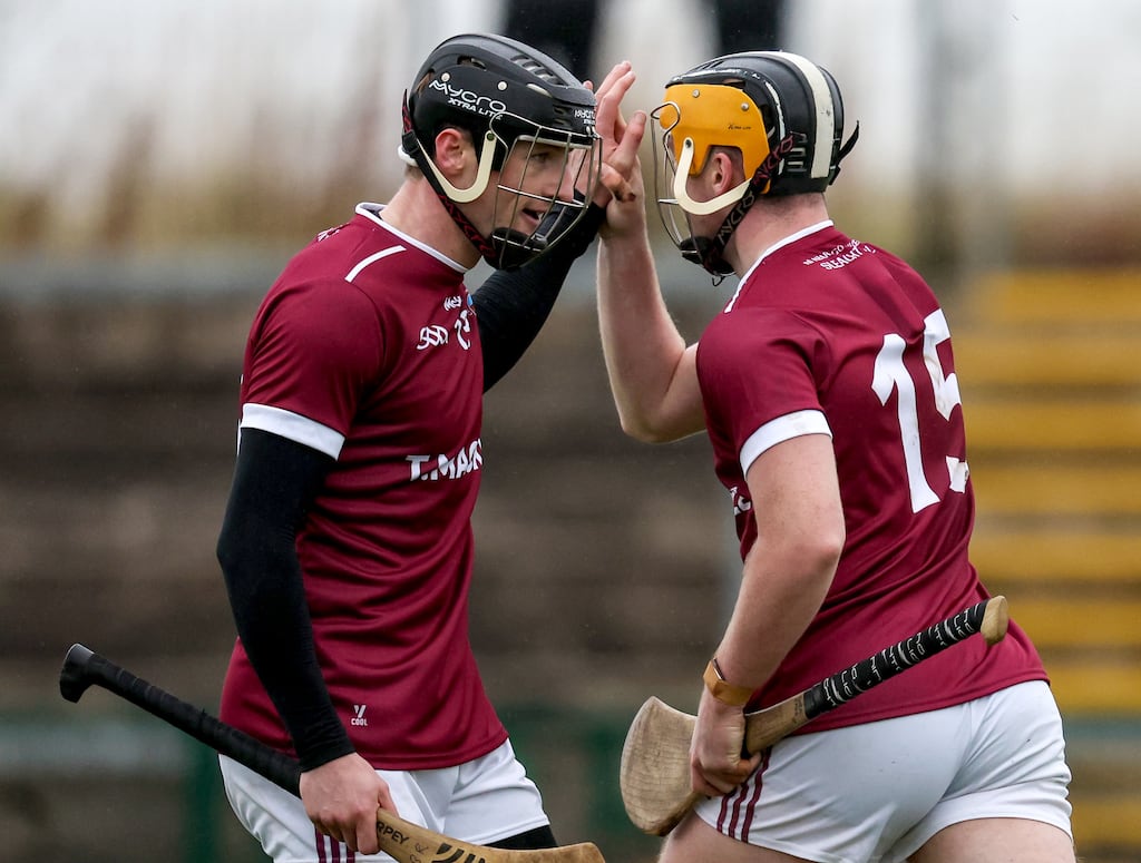 Slaughtneil's Shea Cassidy celebrates scoring his side's second goal with Brendan Rogers during the Derry SHC final against Kevin lynch's at Owenbeg. Photograph: Dan Clohessy/Inpho