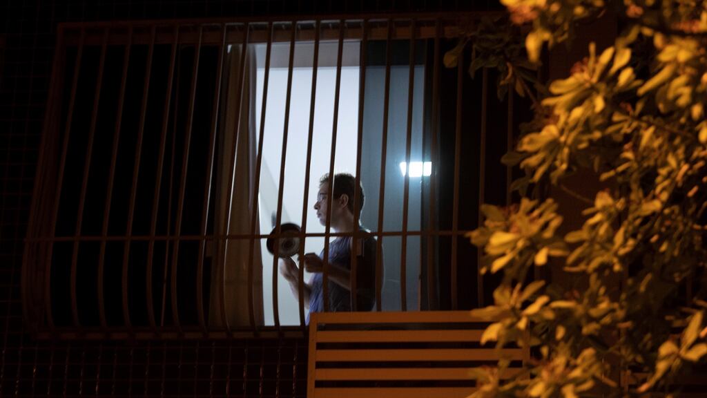 A man in São Paulo bangs on a saucepan in protest during President Jair Bolsonaro’s TV address on Tuesday night. Photograph: Carlos Menezes/EPA