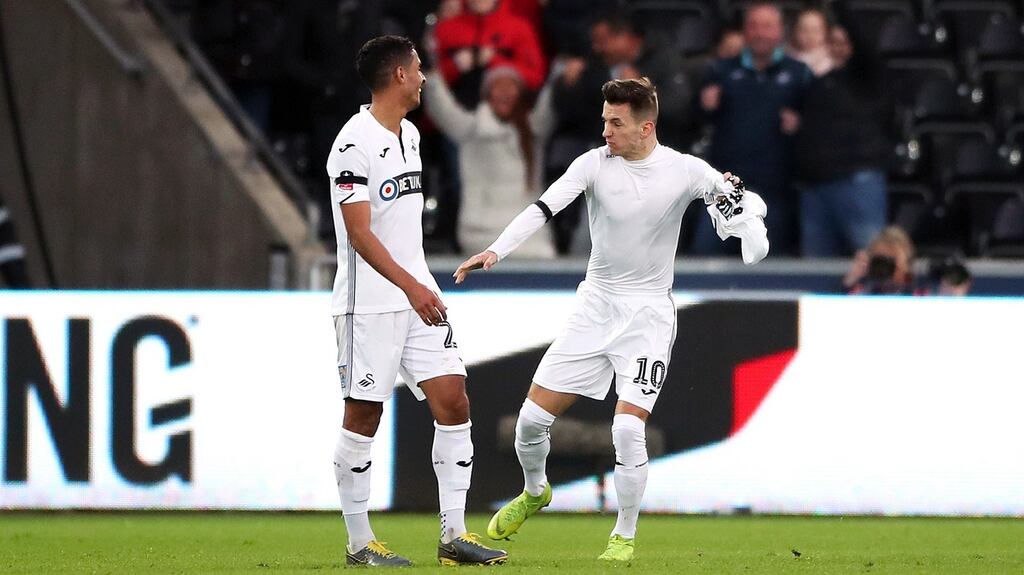 Swansea City’s Bersant Celina (right) celebrates scoring his side’s third goal of the game during the FA Cup fifth round clash with Brentford at the Liberty Stadium. Photo: Nick Potts/PA Wire