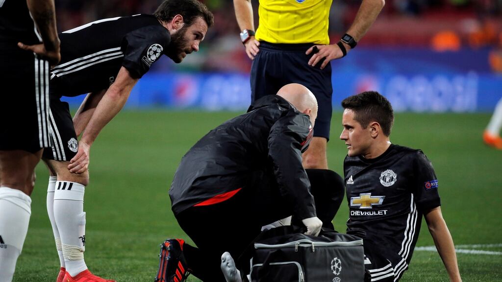 Manchester United’s Ander Herrera receives treatment from the physio after sustaining an injury. Photograph: Jon Nazca/Reuters
