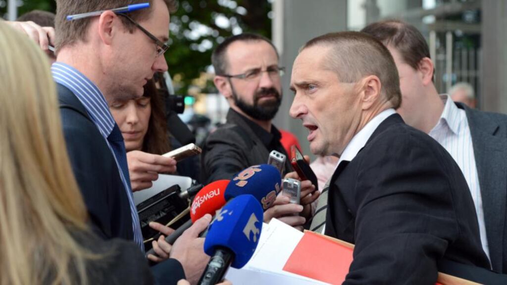 John Dundon’s solicitor John Devane outside the Special Criminal Court yesterday. He said his client wore headphones in court to avoid hearing what he believed would be a “tissue of lies” against him, as he vehemently insists he is innocent. Photograph: Eric Luke