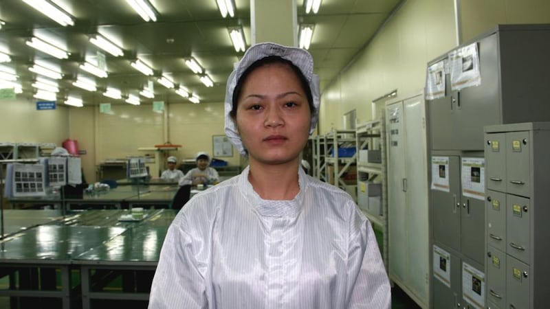 Dao (28) is one of over 4,000 workers at Flexcom’s factory in the Yen Phong Industrial Zone. She earns the equivalent of €175 a month packing electronic components. Photograph: Catherine Healy