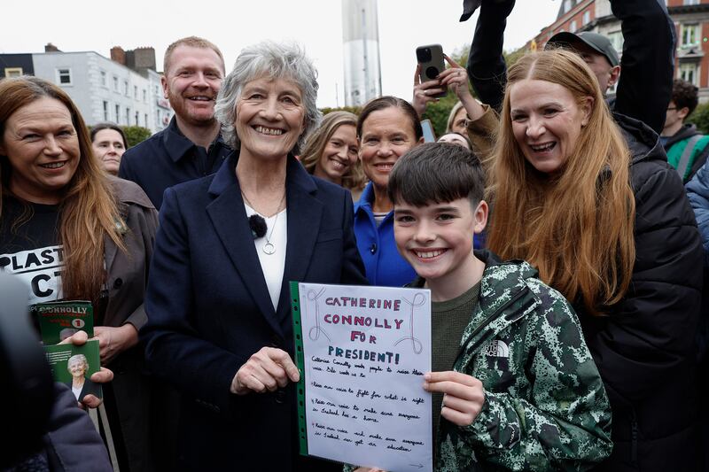 Connolly meets a young supporter, Joshua (10), on O'Connell Street on Sunday. Photograph: Conor O'Mearain/PA Wire