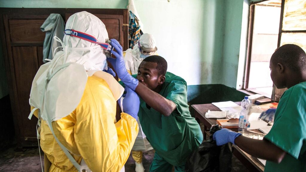 Health workers wear protective equipment as they prepare to attend to suspected Ebola patients at Bikoro Hospital - the epicenter of the latest Ebola outbreak in DRC. Photograph: Mark Naftalin/AFP/Getty Images