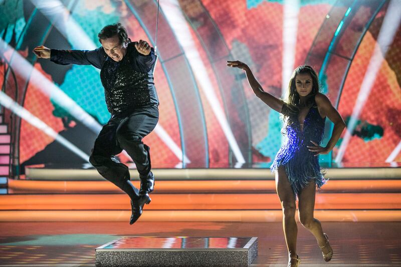 Marty Morrissey leaps in the air during the cha cha with Ksenia Zsikhotska. Photograph: Kyran O’Brien