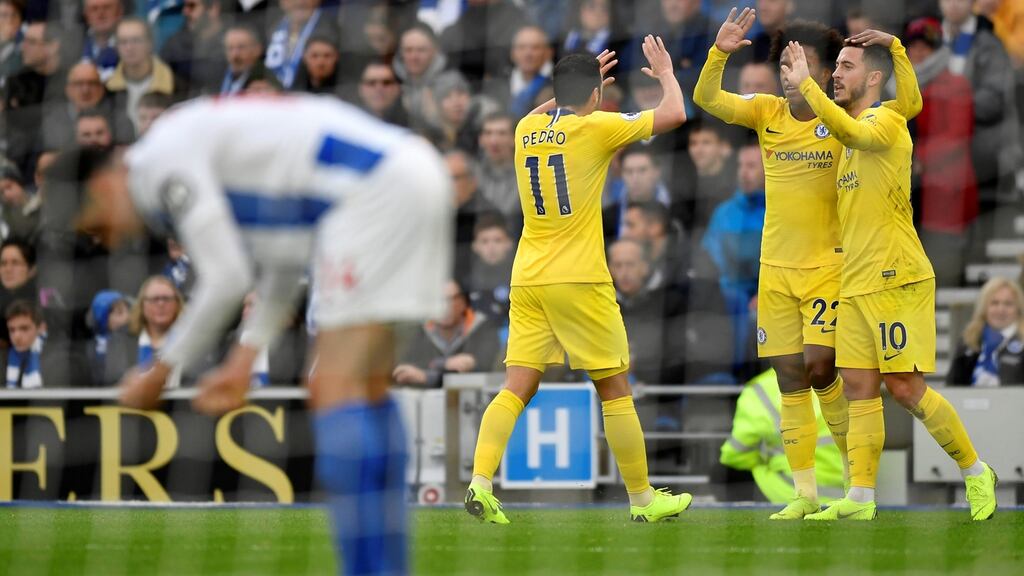 Chelsea’s Eden Hazard celebrates scoring Chelsea’s second goal with Willian and Pedro. Photograph: Pedro
