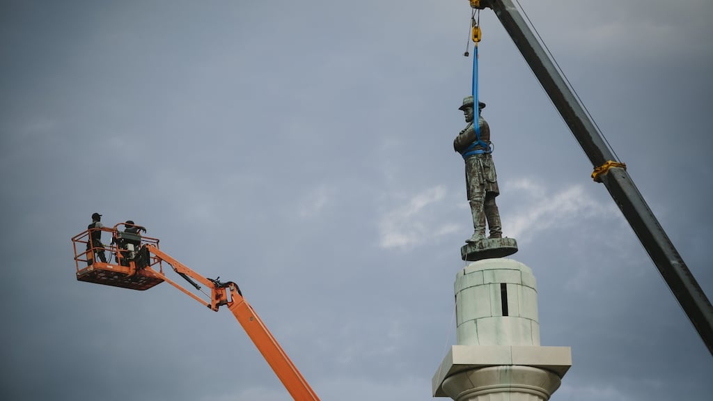 A statue of Robert E Lee is removed from a 70ft column at a prominent traffic circle in New Orleans, May 19th, 2017. Opposition to the removal of the statue and three others symbolic of the Confederacy has been intense; the state legislature passed a law in an attempt to thwart the removals, and contractors involved have been threatened. Photograph: Edmund D Fountain/New York Times