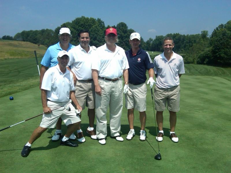 Edward Walsh (in navy T-shirt), who has been confirmed by the US senate as ambassador to Ireland, poses with US president Donald Trump at Trump National Golf Club in Bedminster, New Jersey.