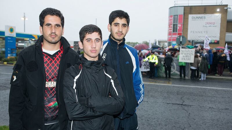 An anti-racism rally in Nutgrove, Rathfarnham earlier this week, organised by United against Racism, and attended by Fazal (20), Naqeeb (18) and Abdul (13) Ahmadzai (in foreground), the victims of a racist attack. Photograph: Dave Meehan/The Irish Times