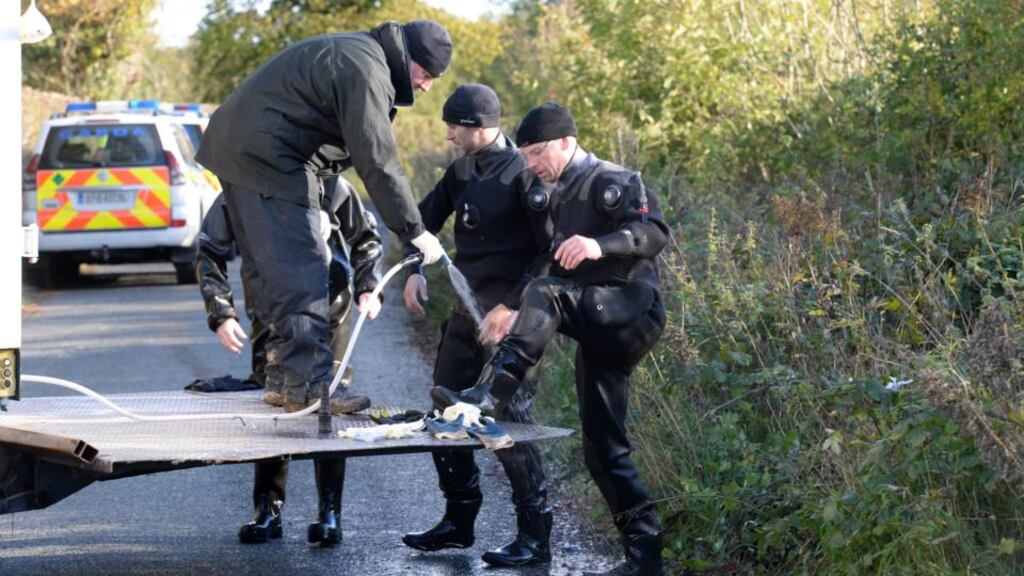 Members of the Garda diver unit amid a search for dismembered remains of Christopher Gaffney last month near Clonee, Co Meath. Photograph: Dara Mac Dónaill/The Irish Times