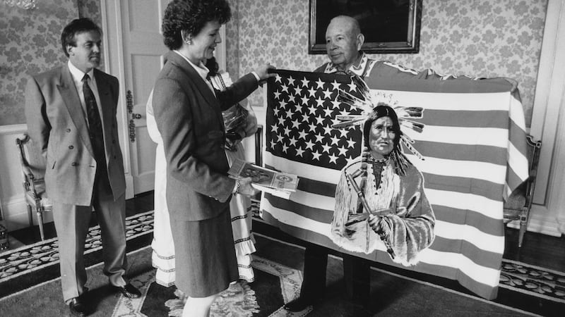President Mrs Mary Robinson is made an honorary Chief of the Choctaw Indian nation of Oklahoma by Randal Dorant (right) speaker of the Choctaw tribal council at Aras an Uachtaráin in 1992. Photograph: Joe St Leger