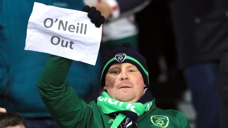 An Ireland fan holds up an “O’Neill out” poster in Aarhus. Photo: Simon Cooper/PA Wire
