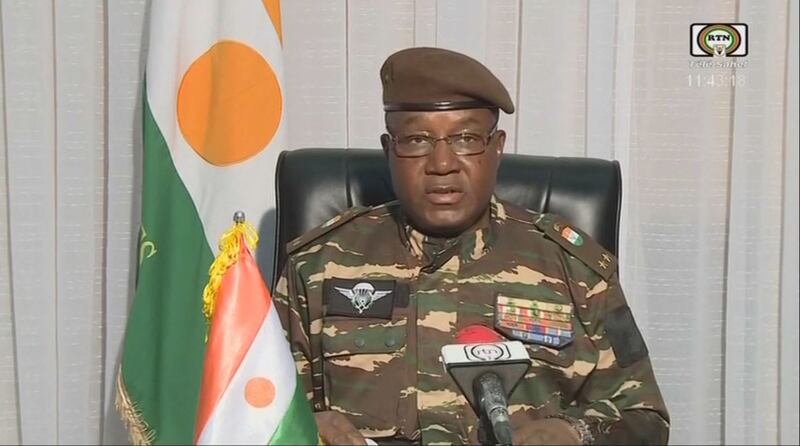General Abdourahamane Tchiani reads a statement as 'President of the National Council for the Safeguarding of the Fatherland'. Photograph: ORTN/Télé Sahel/AFP/Getty Images)
