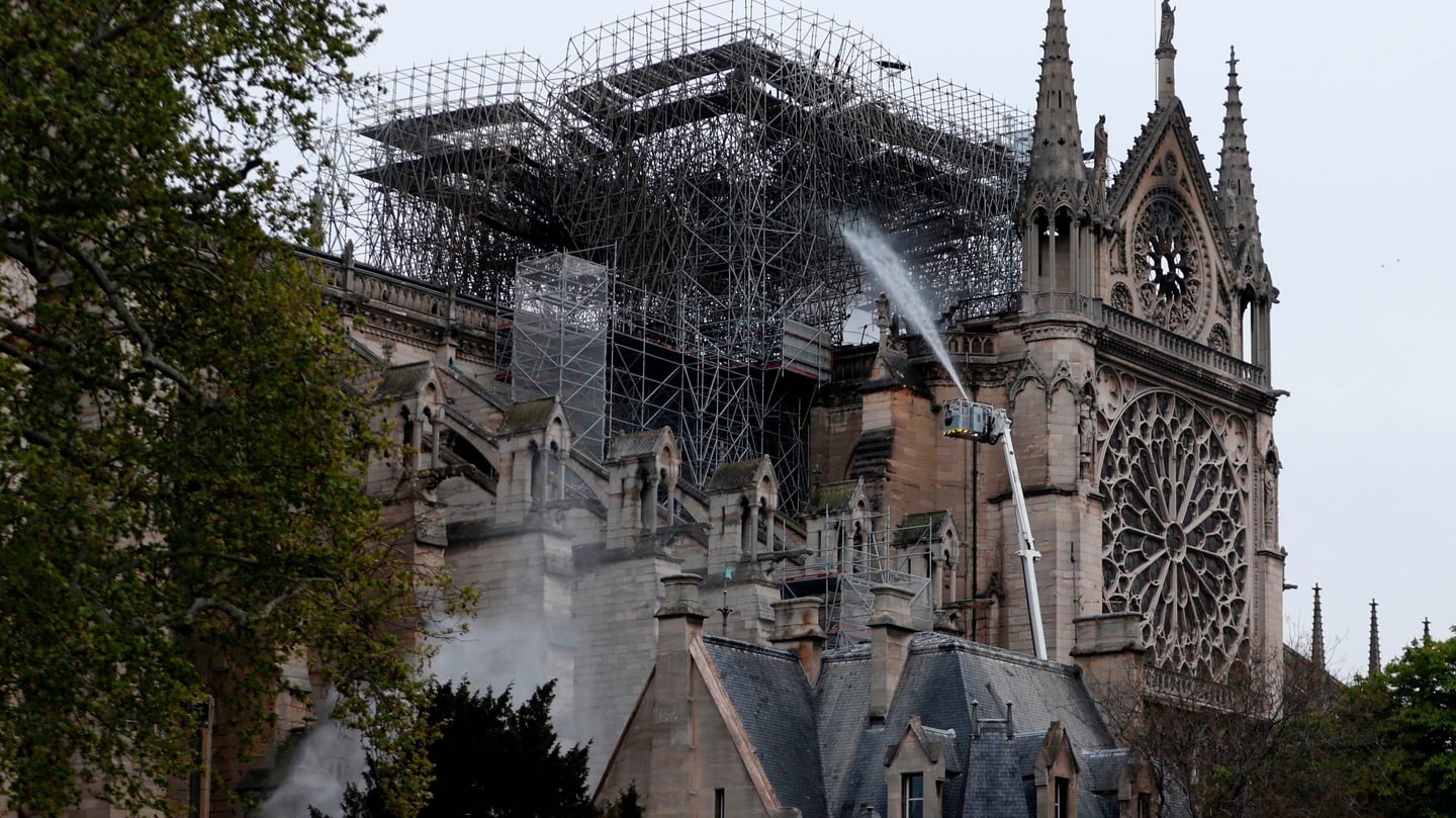‘Under control’: Firefighters work to extinguish a fire at Notre-Dame Cathedral in Paris early on Tuesday. Photograph: Zakaria Abdelkafi/AFP/Getty Images