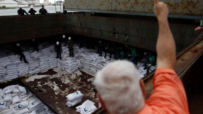 Panama’s president Ricardo Martinelli gives a thumbs up to workers inside a North Korean flagged ship, “Chong Chon Gang”, docked at the Manzanillo Container Terminal in Colon City on Tuesday. Photograph: Carlos Jasso/Reuters