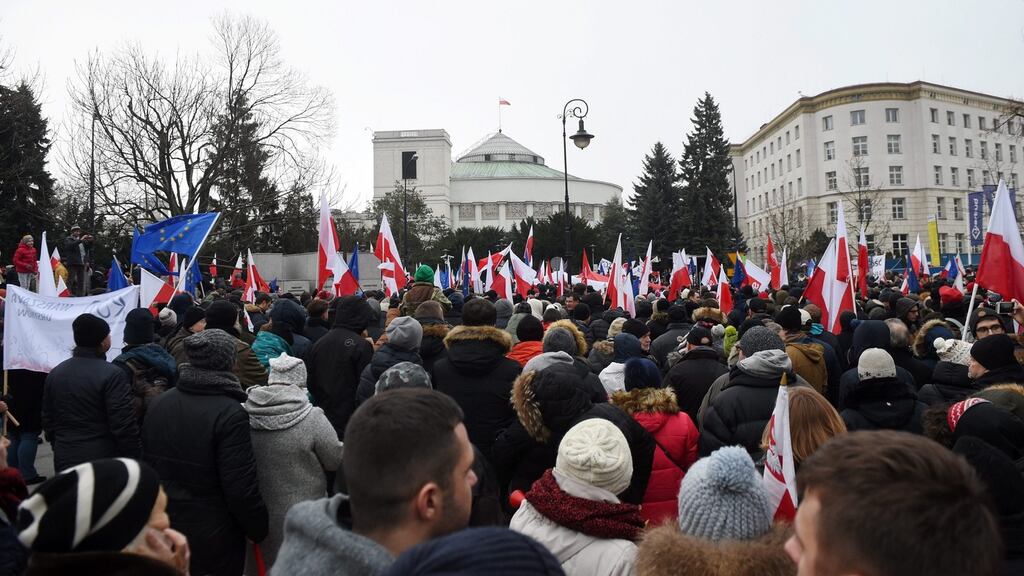 Protesters gather for the fourth day to demonstrate against new media regulations in front of the Sejm building in Warsaw yesterday. Photograph: Radek Pietruszka