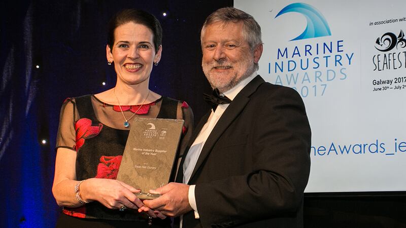 Dr. Dave Jackson, Inspector of Fisheries and manager of the Aquaculture Section in the Marine Institute presents the Marine Industry Supplier of the Year award to Evelyn Kierans, Swan Net Gundry.