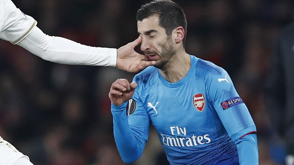 Arsenal’s Armenian midfielder Henrikh Mkhitaryan gets a finger in the eye from Ostersunds’ English midfielder Jamie Hopcutt. Photograph: Getty Images