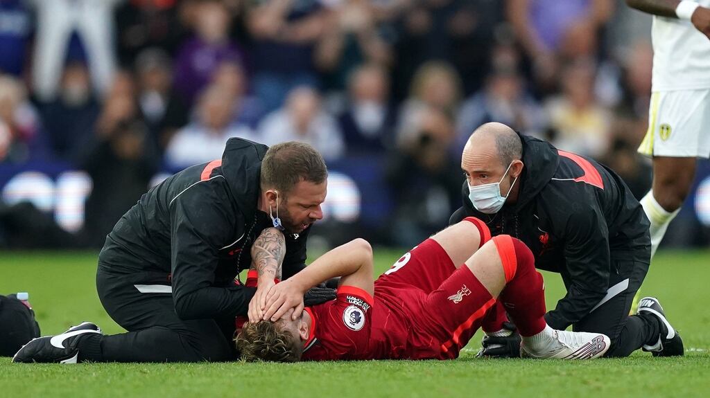 Liverpool’s Harvey Elliott receives treatment during Liverpool’s win over Leeds. Photo: Mike Egerton/PA Wire