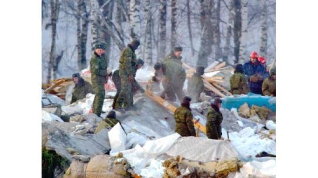 Rescue workers with search dogs picked through rubble and pumped warm air into the ruins of the Transvaal indoor water park whose roof crashed down on hundreds of people.