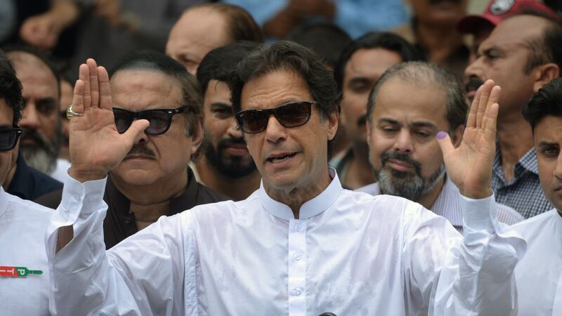 Imran Khan after casting his vote in the general election, in Islamabad, on Wednesday. As prime minister his top challenges will be to strengthen institutions and stamp out corruption. Photograph: Aamir Qureshi/AFP/Getty Images