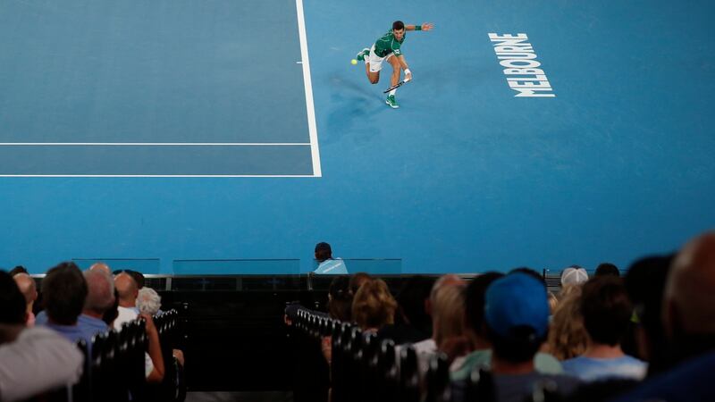 Djokovic reaches for a backhand. Photo: Roman Pilipey/EPA